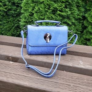Blue purse with lace look print